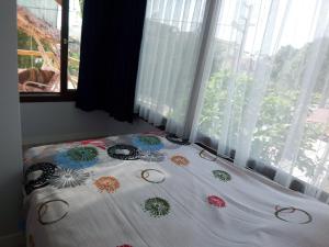 Кровать или кровати в номере izmir Tatil Evi Beach Resort Seferihisar