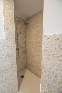 a shower with a glass door in a bathroom at Ocean Lounge in Altea