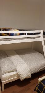 two bunk beds sitting on top of each other at Greater Manchester Immaculate Cozy Home in Oldham
