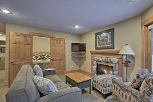 a living room with a couch and a fireplace at Comfy Lutsen Mountain Villa with Balcony and Grill in Lutsen