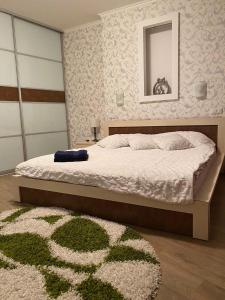 Katil atau katil-katil dalam bilik di Most City Apartments Magnolia