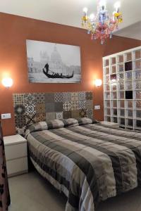Кровать или кровати в номере Apartamentos El Templo Suites