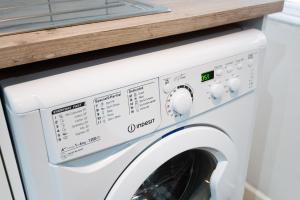 a white washer and dryer in a kitchen at Perfect Location with Parking -Jersey Lodge in Swansea