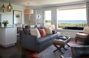 a living room with a couch and a table at Inn By the Sea in Cape Elizabeth