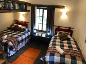 Un pat sau paturi într-o cameră la Karina Wasi