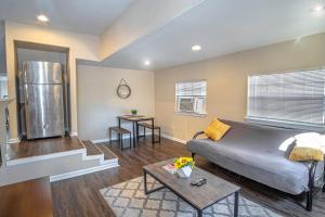 a living room with a couch and a table at Houston St Guest house near Downtown/Military base in San Antonio