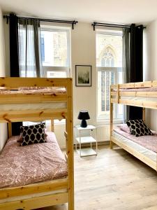 a room with two bunk beds and a window at BONJOUR Apartments Сentre 3 in Antwerp