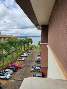 a view of a parking lot with cars parked at Flat à Beira Lago in Brasilia