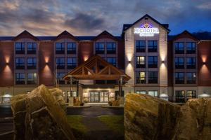 a rendering of the exterior of a hotel at Microtel Inn & Suites by Wyndham Mont Tremblant in Mont-Tremblant