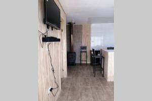 TV a/nebo společenská místnost v ubytování Cabaña Con Tinajas #2