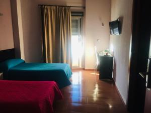 Postel nebo postele na pokoji v ubytování Hotel Almoradi