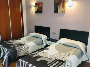 Postel nebo postele na pokoji v ubytování Hotel Almoradi
