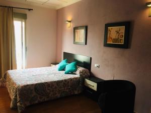 Postel nebo postele na pokoji v ubytování Hotel Almoradi