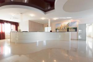 a lobby with a reception desk in a building at Grand Hotel Sofia in Noto