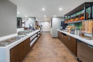 a large kitchen with a long line of counters at Wyndham Garden Marietta Atlanta North in Marietta