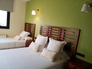 Les Flors - Hotel Rural & Cabanyes客房内的一张或多张床位
