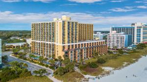 an aerial view of a large building next to the water at Direct oceanfront, separate bedroom condo, 9th floor, unbelievable views! in Myrtle Beach