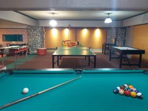 a billiard room with two ping pong tables at Apart Gala in Mendoza