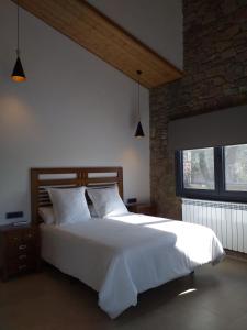 Les Flors - Hotel Rural & Cabanyes客房内的一张或多张床位