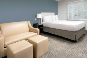 Posteľ alebo postele v izbe v ubytovaní WoodSpring Suites Murfreesboro