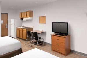 A television and/or entertainment centre at WoodSpring Suites Killeen