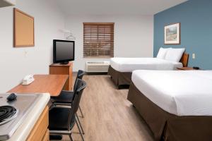 Postel nebo postele na pokoji v ubytování WoodSpring Suites Killeen