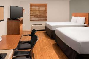 A television and/or entertainment centre at WoodSpring Suites San Angelo