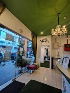 a store front with a chandelier and a room at Olive Hotel in Johor Bahru