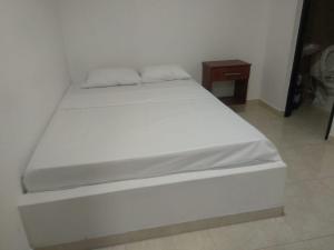 Postel nebo postele na pokoji v ubytování Hotel Central Fusa