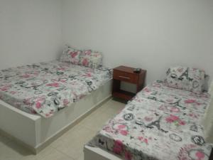Postel nebo postele na pokoji v ubytování Hotel Central Fusa