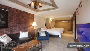 מיטה או מיטות בחדר ב-Sheng Shine Forest Resort