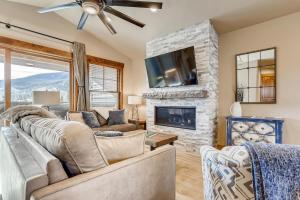 a living room with a couch and a fireplace at Estates on Galena #8 townhouse in Frisco