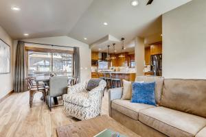 a living room with a couch and a table at Estates on Galena #8 townhouse in Frisco