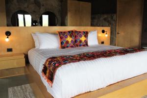 Parra del Valle Hotel Boutique tesisinde bir odada yatak veya yataklar