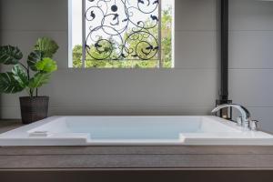 a white sink in a kitchen with a window at Okinawa Villa KILOHANA in Inbu +39 photos
