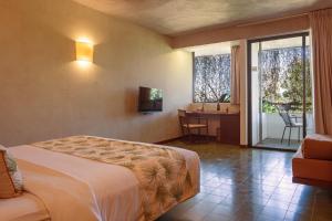Postel nebo postele na pokoji v ubytování Penh House Hotel