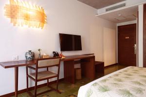 TV a/nebo společenská místnost v ubytování Penh House Hotel