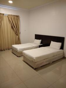 Tempat tidur dalam kamar di Avene For Furnished Residential Units