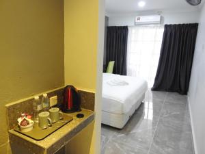 TEBiNG Guest House Taman Negara Malaysia Kuala Tahan客房内的一张或多张床位