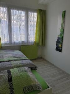 
Ein Bett oder Betten in einem Zimmer der Unterkunft Appartement d'hôtes An Kaz La
