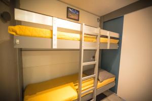 a bunk bed in a room with two bunk beds at Vue Lac - Appartement 4 personnes - Tignes le Lac - 803 - Le Palafour in Tignes