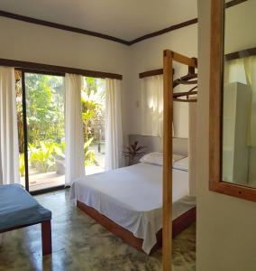 Giường trong phòng chung tại Higala Hostel Siargao