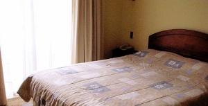 Säng eller sängar i ett rum på Posada del Salvador