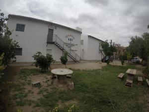 a building with a picnic table in front of it at RESIDENCIAL SIC in Aimogasta