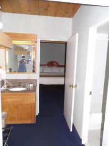 a bathroom with a sink and a bunk bed at America's Best Value Inn Sandpoint in Sandpoint +49 photos