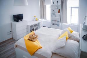 Televízia a/alebo spoločenská miestnosť v ubytovaní Malasits Art Home