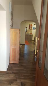 a hallway with a door leading to a living room at Appartamento " CENTRAL" in Arzachena