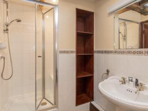 a bathroom with a sink and a shower at Riven Oak in Kendal +22 photos