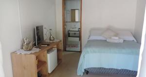 Cama ou camas em um quarto em Pousada Ilha do Mel