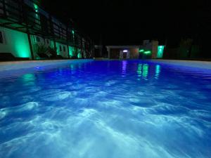 A piscina localizada em Hotel MANDALA BEACH CHIHUAHUA Naturista Nudista Opcional -Exclusivo Adultos- ou nos arredores